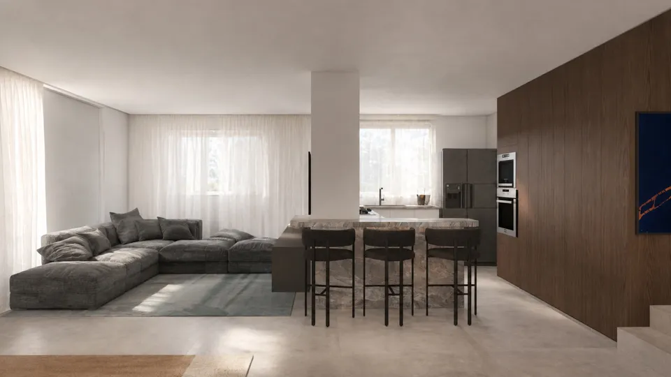Sala com sofá cinza e cozinha integrada